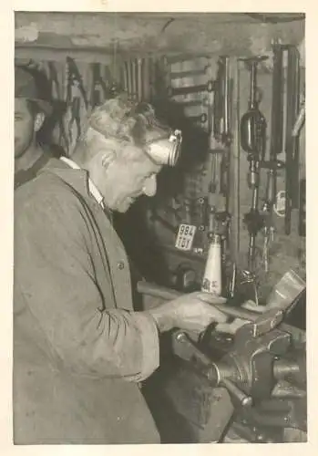 Anonymous man working vise photo