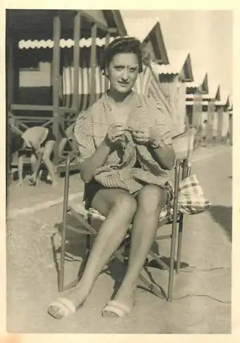 Anonymous persons woman knitting on the beach