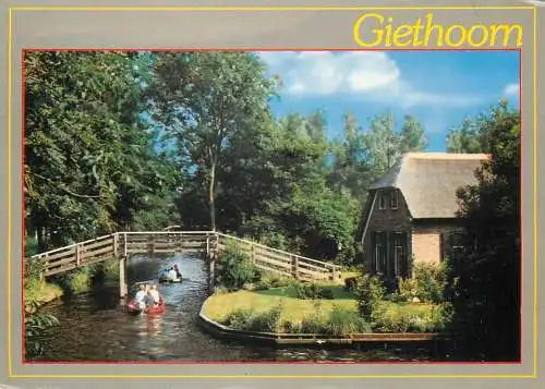 Netherlands Giethoorn wooden bridge & boats on canal