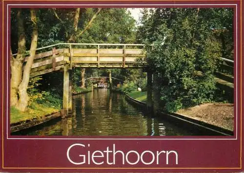 Netherlands Giethoorn wooden rustic bridge over canal