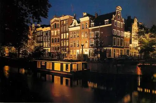 Amsterdam by night canal house boats