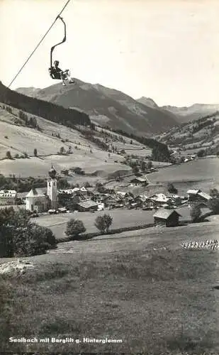 Austria Saalbach  mit Berglift gegen Hinterglemm