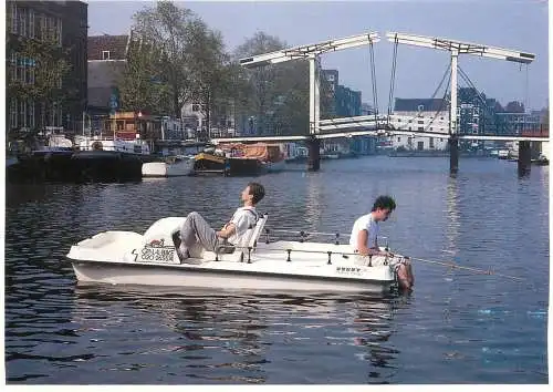 Netherlands Amsterdam bridge boatsboy fishing
