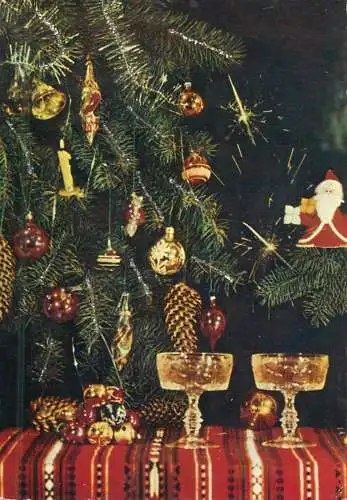 New Year's greetings champagne glasses and decorated tree detail aspect