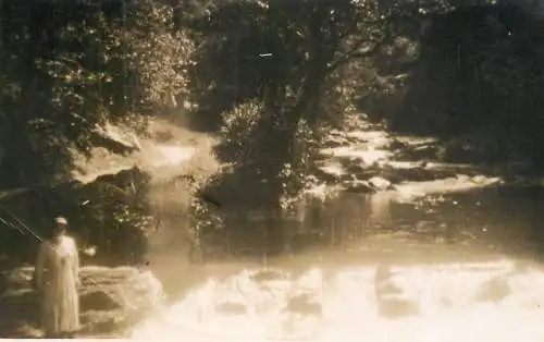 Real photo postcard place to identify lady river
