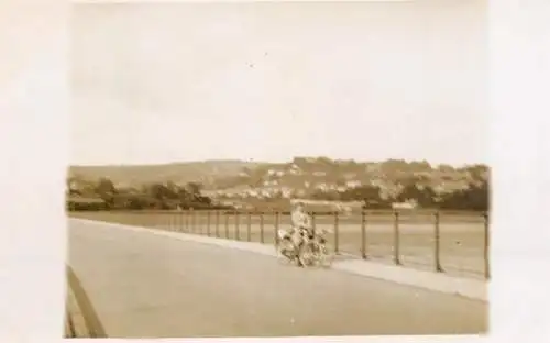 Real photo postcard place to identify elegant lady bicycle