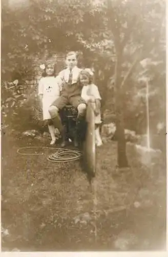 Real photo postcard place to identify elegant children