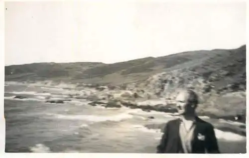 Real photo postcard place to identify man sea coast