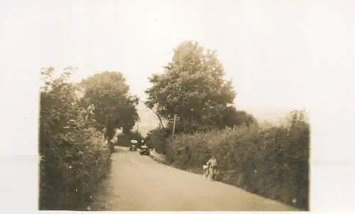 Real photo postcard place to identify automobile