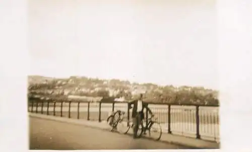 Real photo postcard place to identify man bicycle