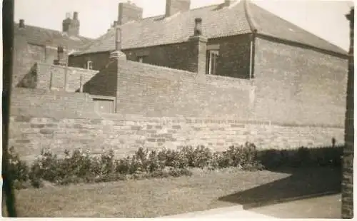 Real photo postcard place to identify house wall
