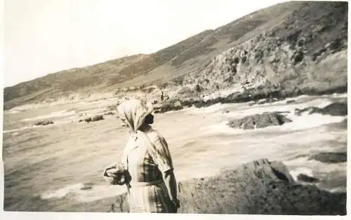 Real photo postcard place to identify lady beach side