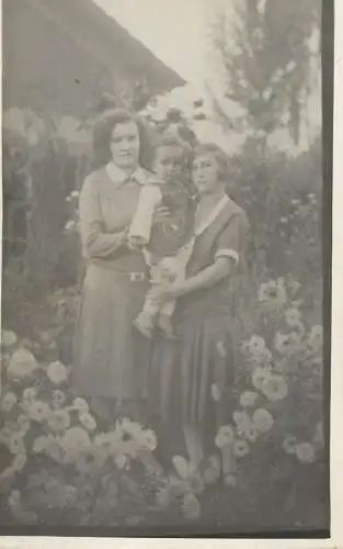 Social history souvenir photo postcard mother and children in flower field