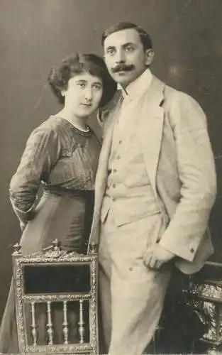 Social history souvenir photo postcard couple moustache dress