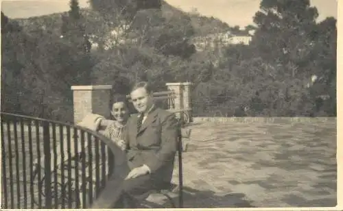 Social history souvenir photo postcard elegant coupleon bench