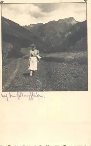 Social history souvenir photo postcard woman in nature mountain scene