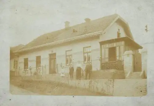 Social history souvenir real photo family in front of house