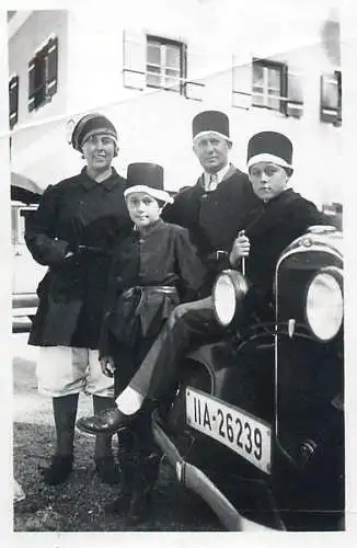 Anonymous persons family souvenir photo costumes automobile plate