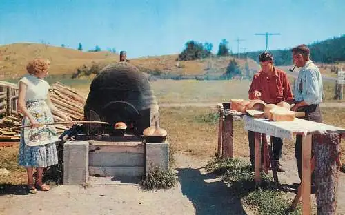 People baking bread in old oven