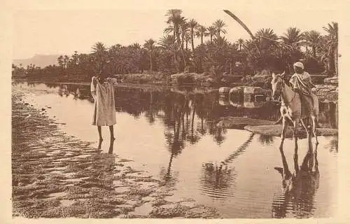 Algeria people at the river in the desert ethnic types and scenes