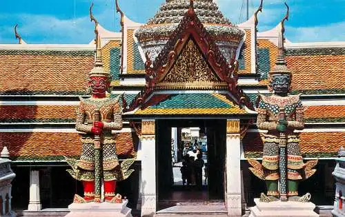 Thailand Bangkok Temple of Emerald Buddha giant masked gods guarding the entrance
