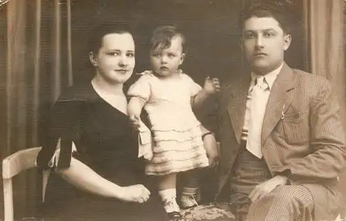 Anonymous persons social history souvenir photo postcard couple and daughter