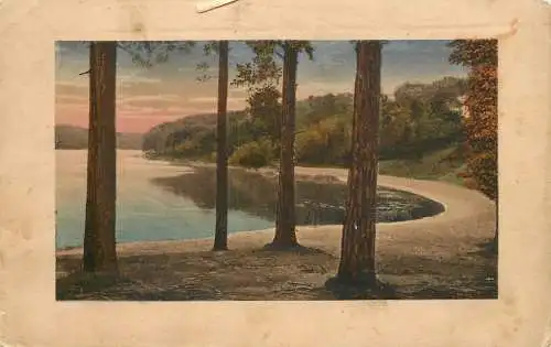 Postcard illustrators painting lake scene and forest
