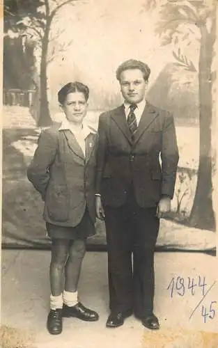 Photograph social history family scene elegance 1944 haircut men