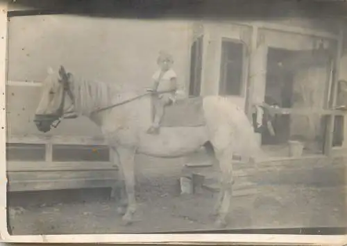 Horse mounted child instant photography