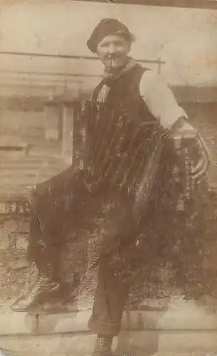 lady with harmonica and pipe rppc