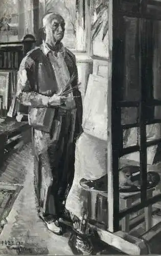Man in work studio painting signed artwork