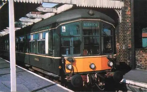 Railway train locomotive Diesel Multiple Unit in green livery leaving Wells-on-Sea Station