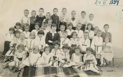 School history souvenir photo postcard teacher and large group of children dated 1934