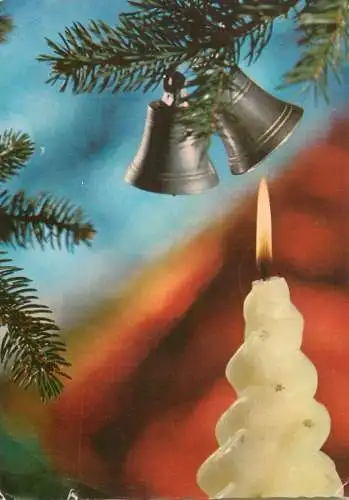 Christmas greetings lit candle & bells decorative ornaments detail view