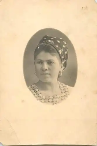 Woman with wimpel head decoration portrait