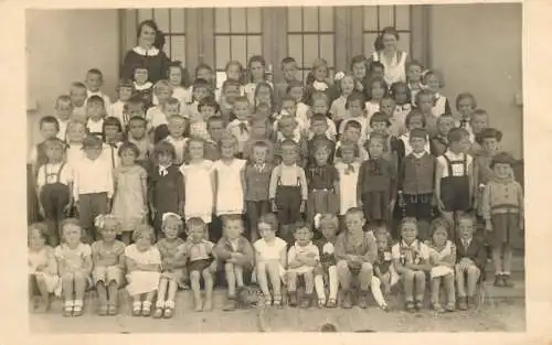 School history teachers with group of children photo postcard