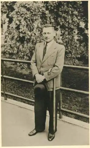 Annonymous person portrait vintage souvenir photo postcard elegant man hat cane