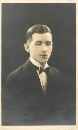 Annonymous person portrait vintage souvenir photo postcard elegant young man