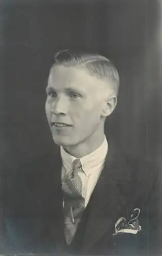 Annonymous person portrait vintage souvenir photo postcard elegant young man