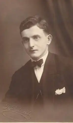 Annonymous person portrait vintage souvenir photo postcard elegant man bow tie