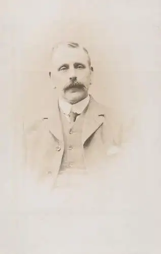 Annonymous person portrait vintage souvenir photo postcard elegant man moustache
