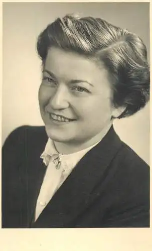 Annonymous person portrait vintage souvenir photo postcard elegant woman smile