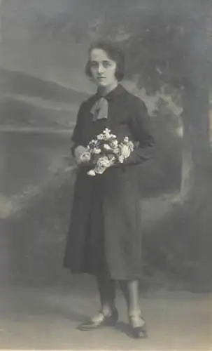 Annonymous person portrait vintage souvenir photo postcard elegant woman flower bouquet