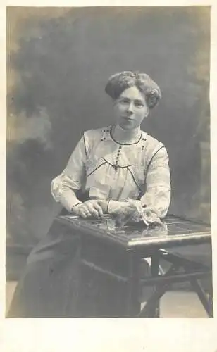 Annonymous person portrait vintage souvenir photo postcard elegant woman coiffure