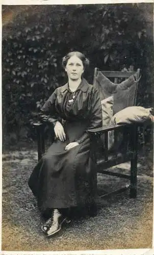 Annonymous person portrait vintage souvenir photo postcard elegant woman coiffure