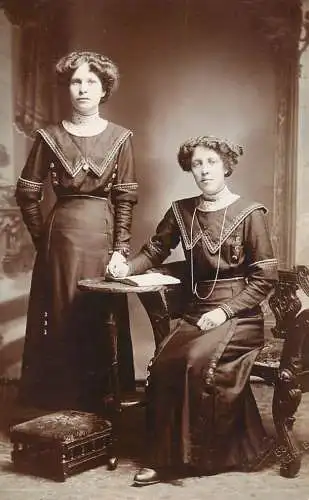 Annonymous person portrait vintage souvenir photo postcard elegant sisters pearls coiffure