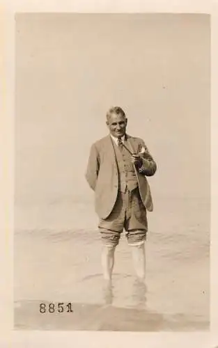 British social history souvenir photo elegant man at the beach with pipe