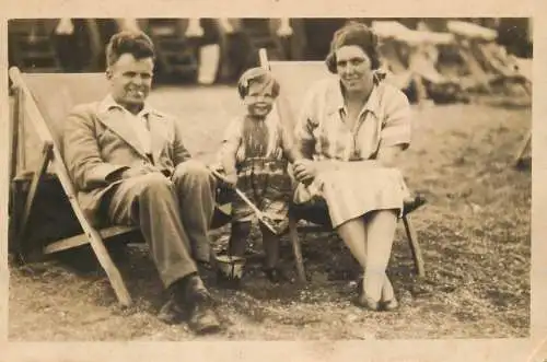 British social history souvenir photo elegant couple and daughter at beach