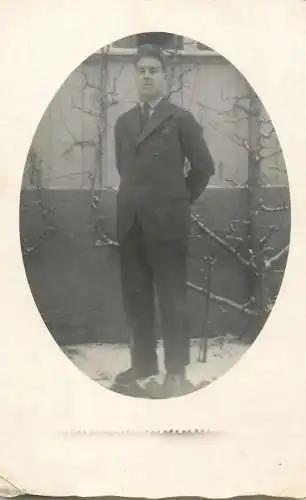 Men portrait vintage photo postcard elegant man in the yard in winter snow