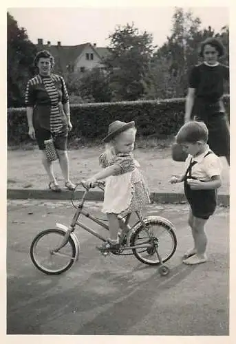 Children cycling bicycle
